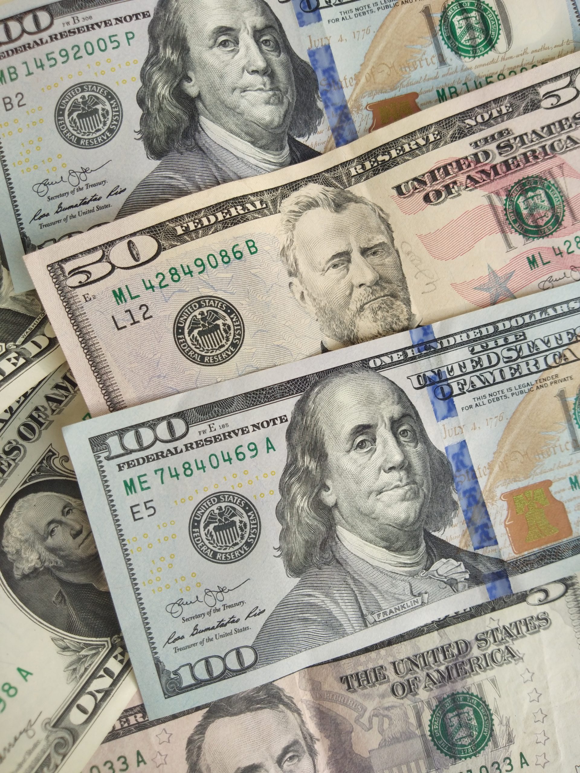 closeup photo of 100 US dollar banknotes